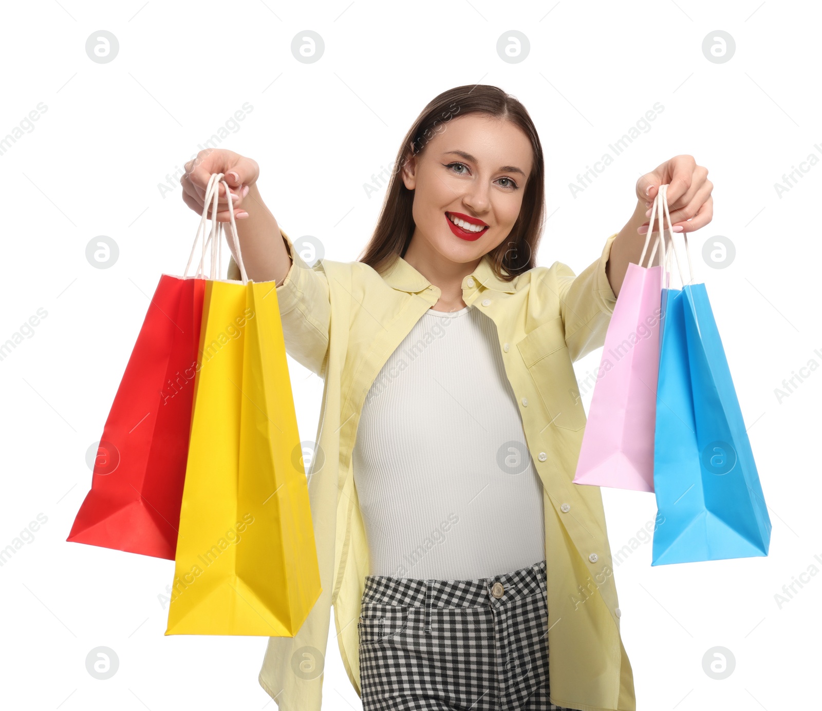 Photo of Stylish young woman with shopping bags on white background