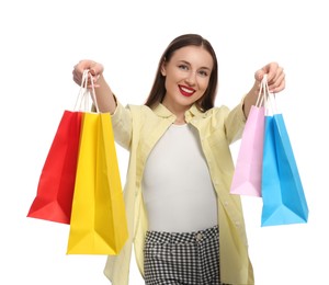 Photo of Stylish young woman with shopping bags on white background