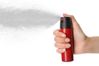 Image of Woman using pepper spray on white background, closeup