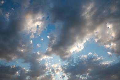 Beautiful view of blue sky with dark clouds on sunny day