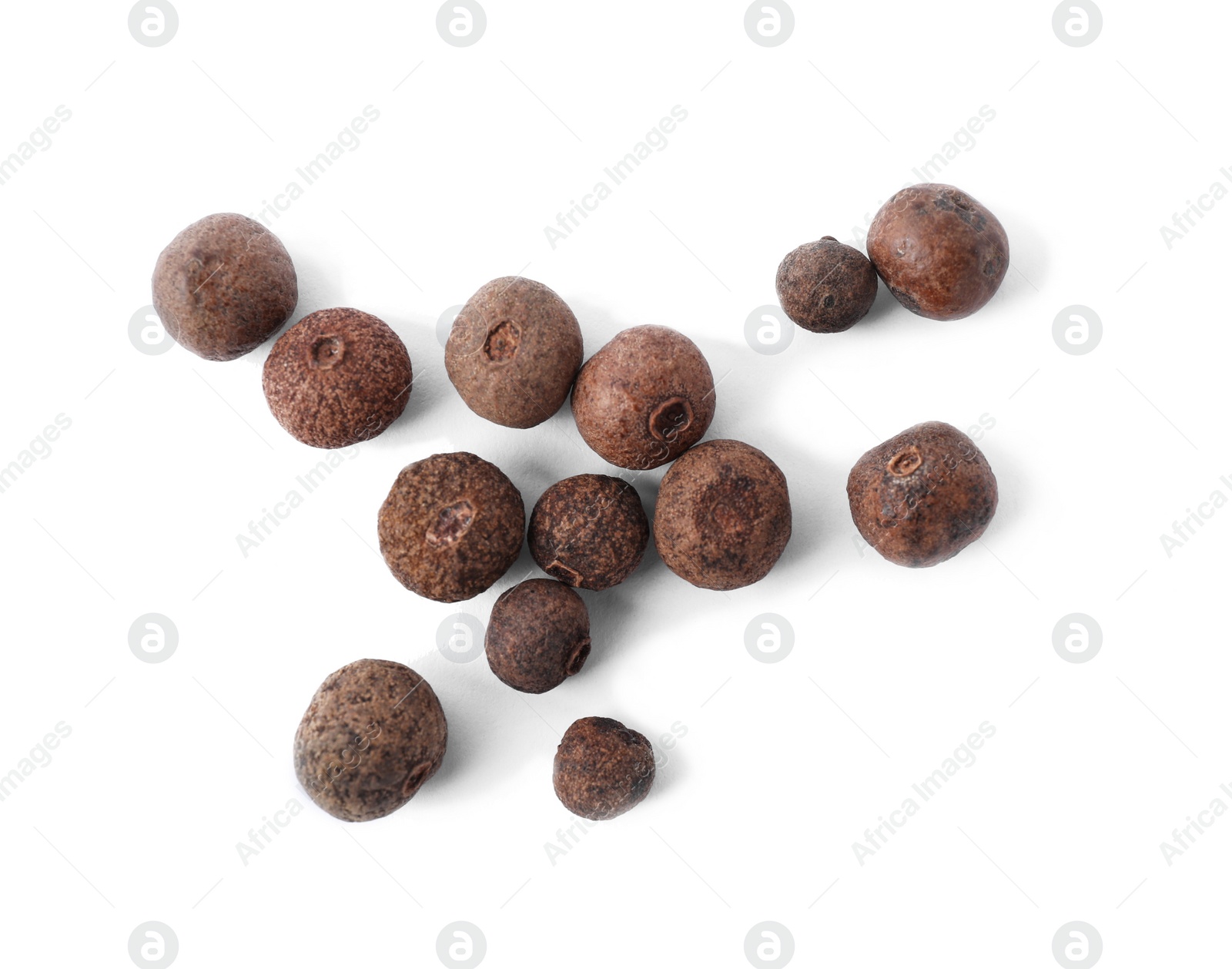 Photo of Black pepper grains on white background, top view