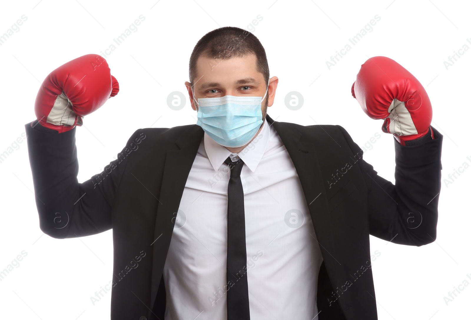 Photo of Businessman with protective mask and boxing gloves on white background. Strong immunity concept