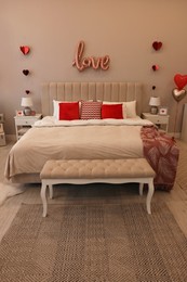 Photo of Cozy bedroom decorated for Valentine Day. Interior design