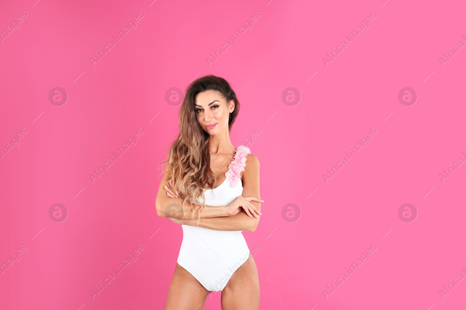 Photo of Pretty sexy woman in stylish bikini on color background