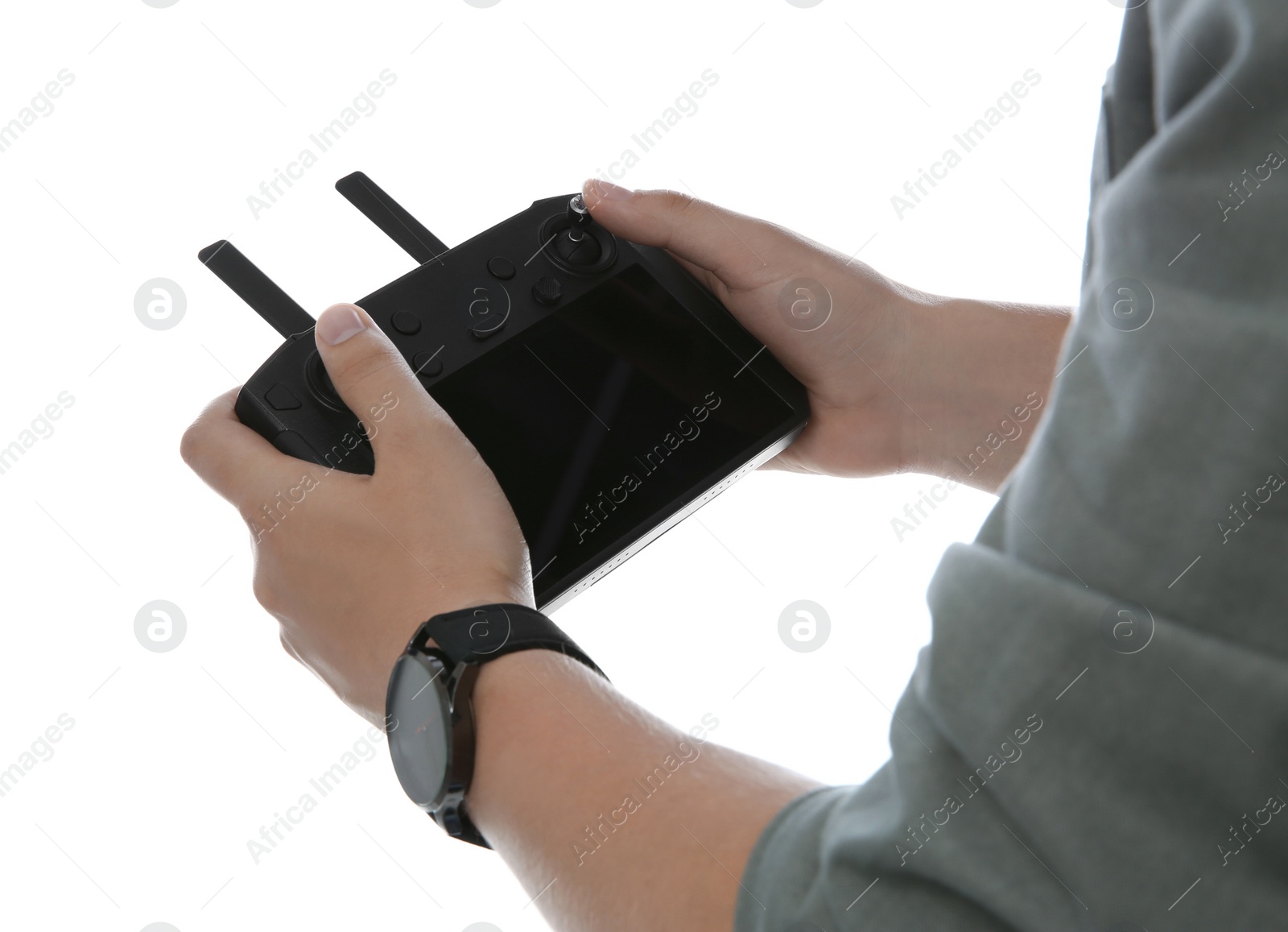 Photo of Man holding new modern drone controller on white background, closeup of hands
