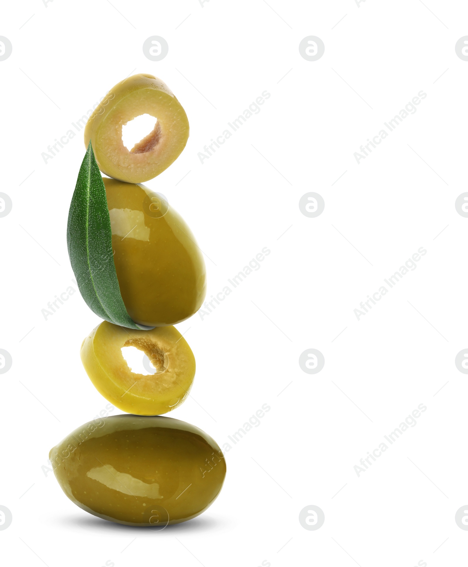 Image of Cut and whole olives with leaf on white background