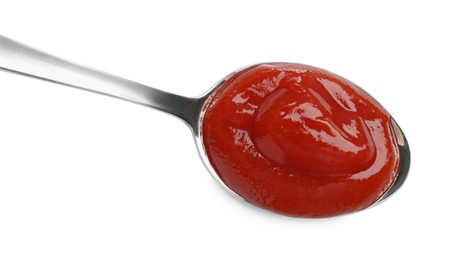 Photo of Tasty ketchup with spoon isolated on white, top view. Tomato sauce