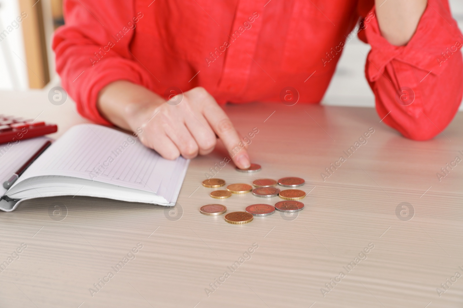 Photo of Woman counting money at table indoors, closeup