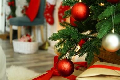 Blurred view of beautiful festive interior, focus on decorated Christmas tree