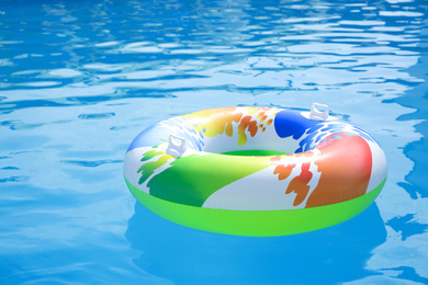 Photo of Inflatable ring in swimming pool on sunny day