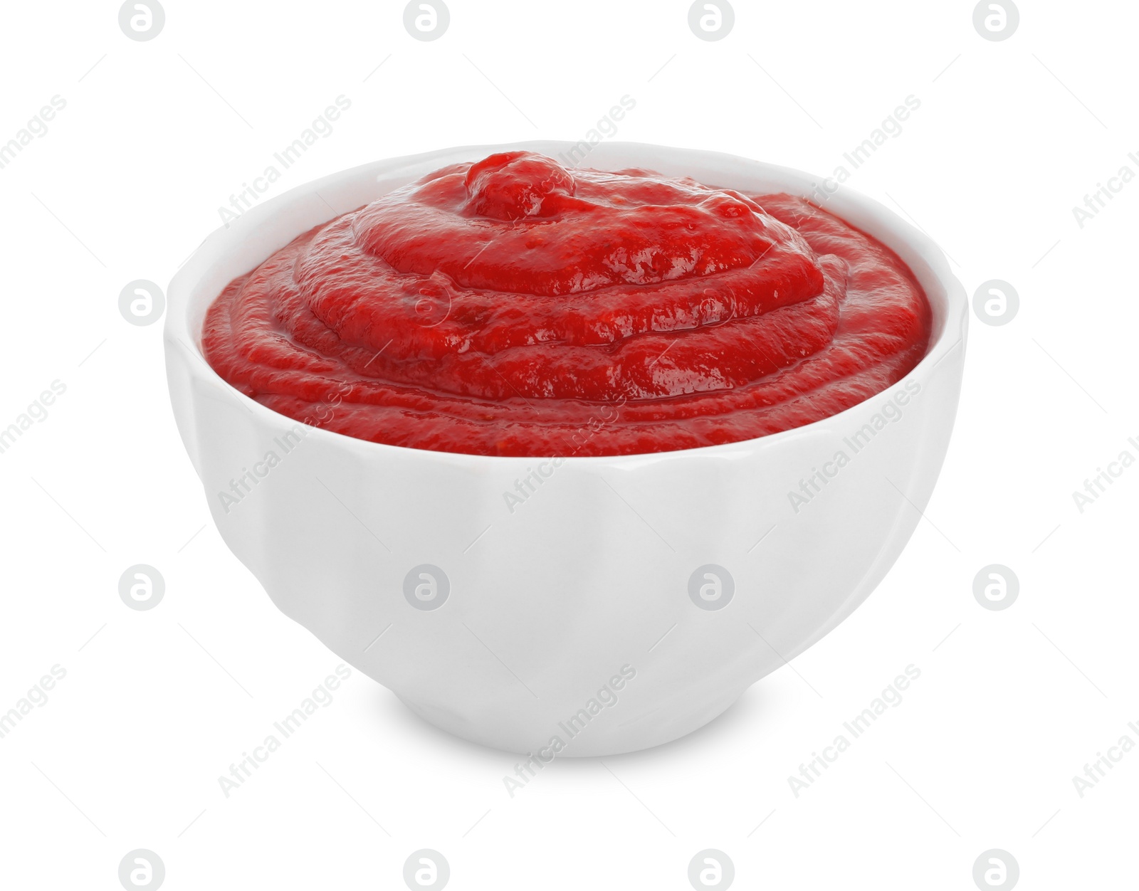 Photo of Tasty ketchup in bowl isolated on white. Tomato sauce