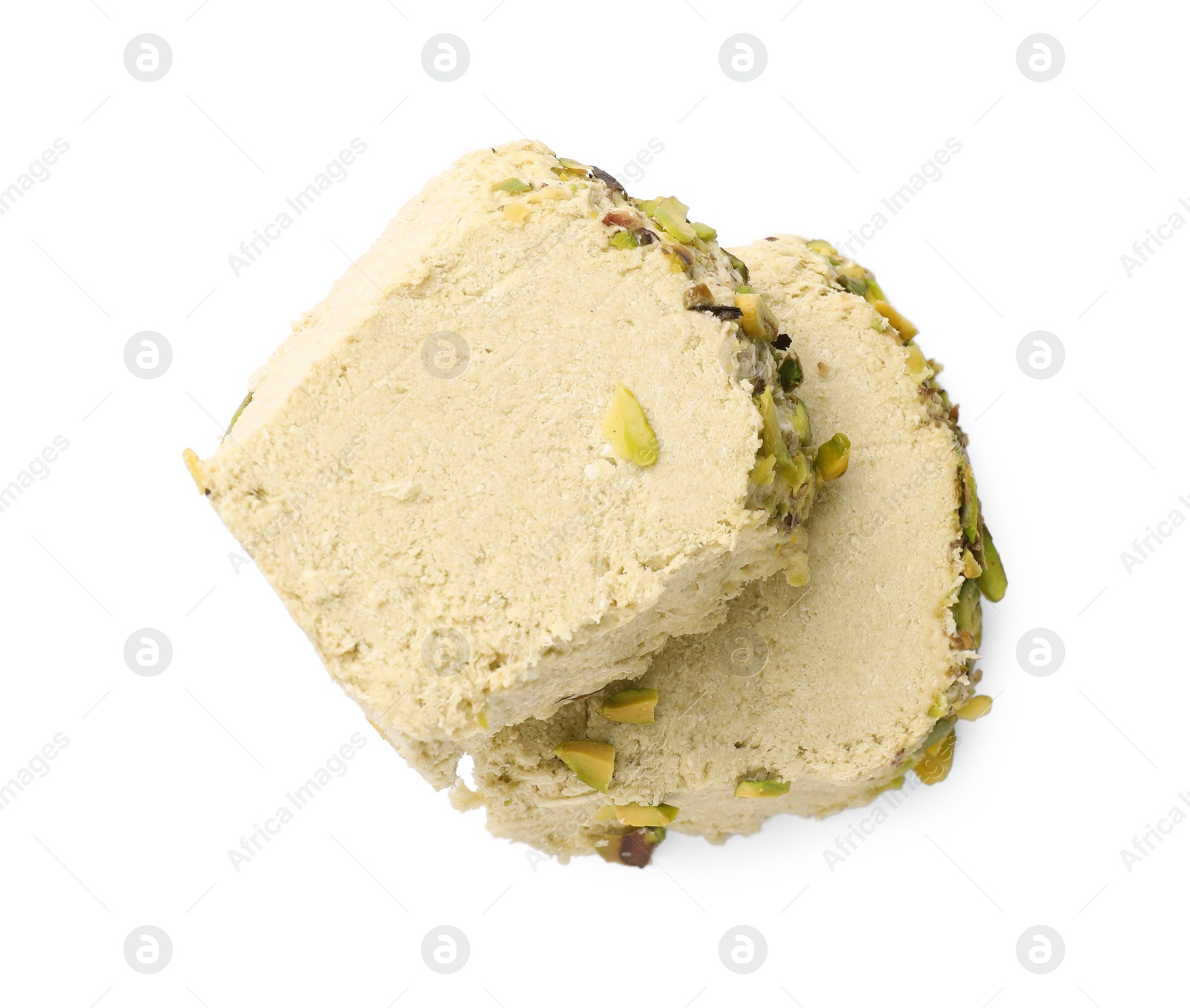 Photo of Pieces of tasty halva with pistachios on white background, top view