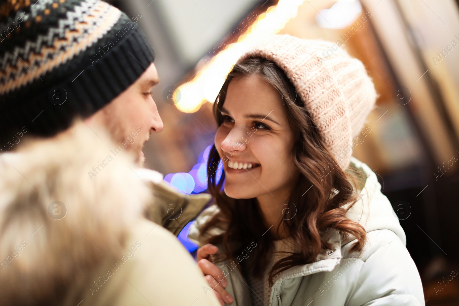 Photo of Lovely couple on city street. Winter vacation