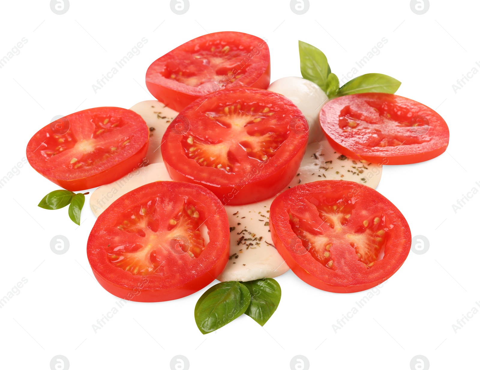 Photo of Delicious Caprese salad with tomatoes, mozzarella cheese, basil leaves and herbs isolated on white