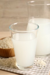 Natural rice water and grains on table, closeup