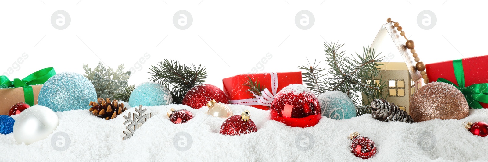 Photo of Christmas decoration on snow against white background