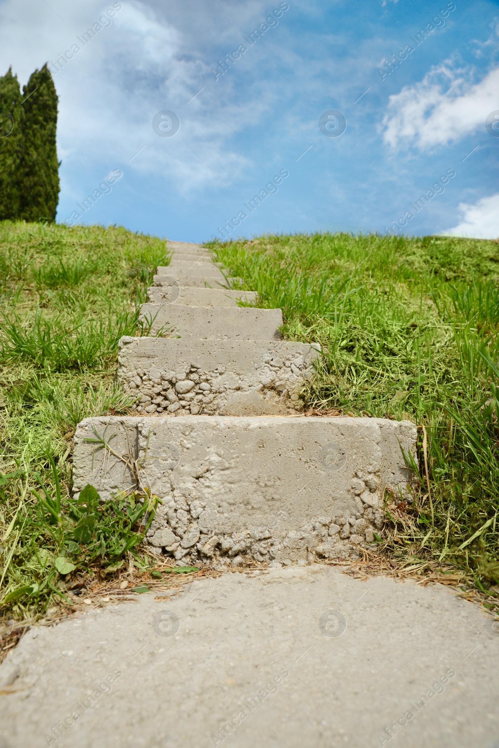 Photo of Outdoor concrete staircase up to hill, low angle view