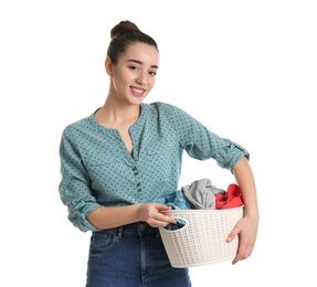 Photo of Happy young woman holding basket with laundry on white background