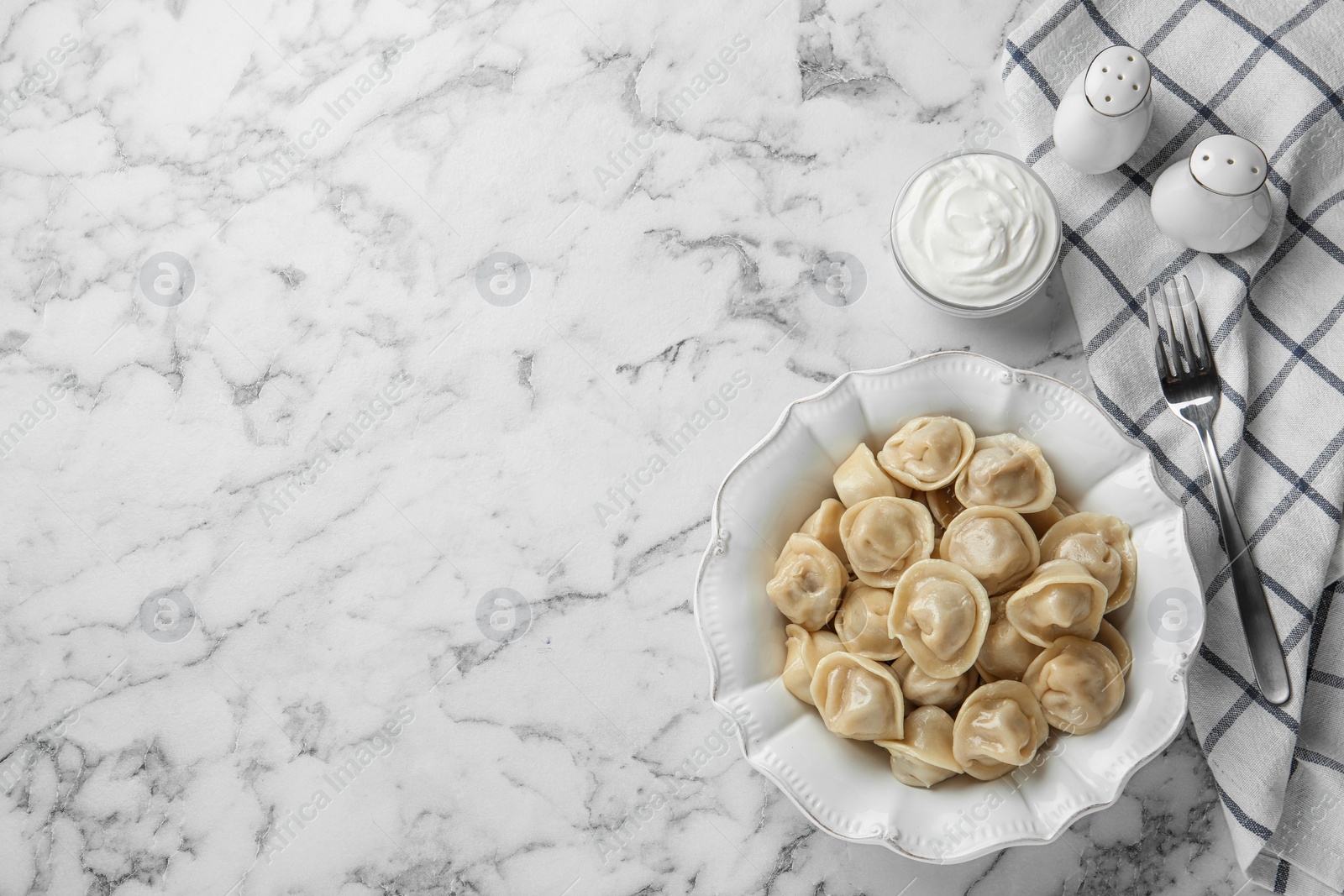 Photo of Flat lay composition with tasty dumplings on marble table, flat lay. Space for text