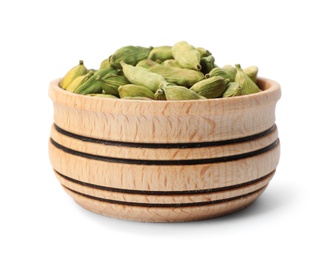 Photo of Wooden bowl with cardamon on white background. Different spices