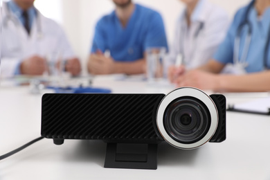 Video projector on table during medical conference