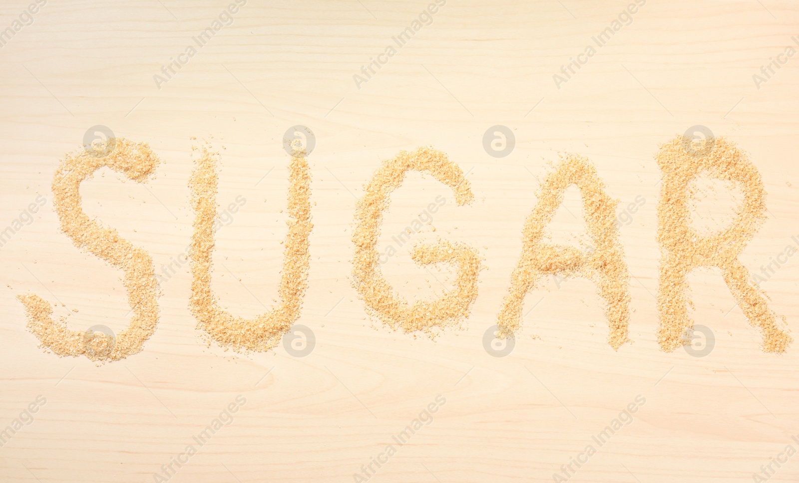 Photo of Word SUGAR on wooden background