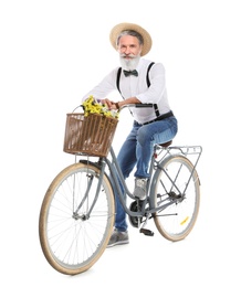 Portrait of handsome mature man with bicycle on white background
