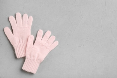 Photo of Stylish gloves on grey background, flat lay. Space for text
