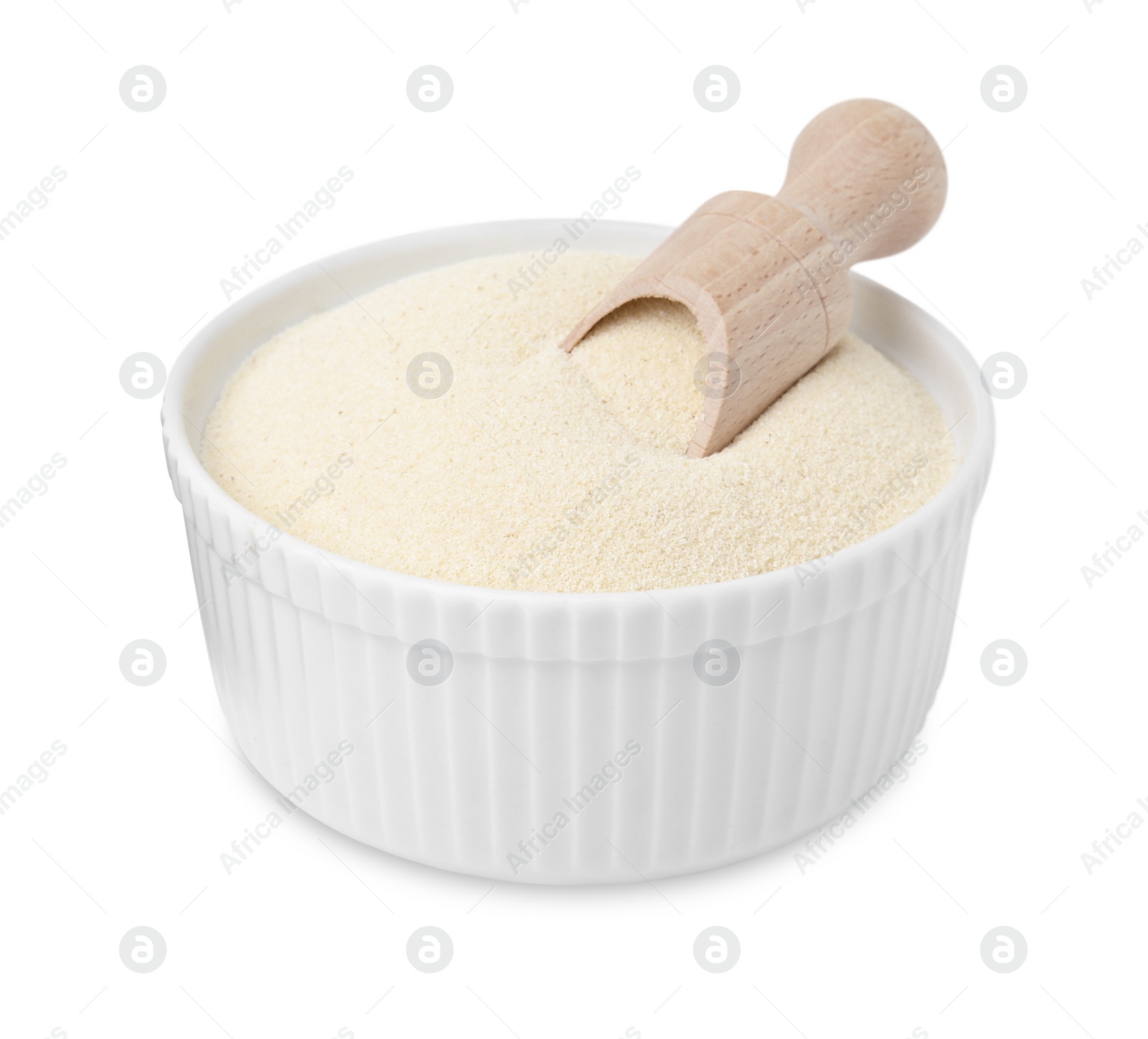 Photo of Bowl of uncooked organic semolina with wooden scoop isolated on white