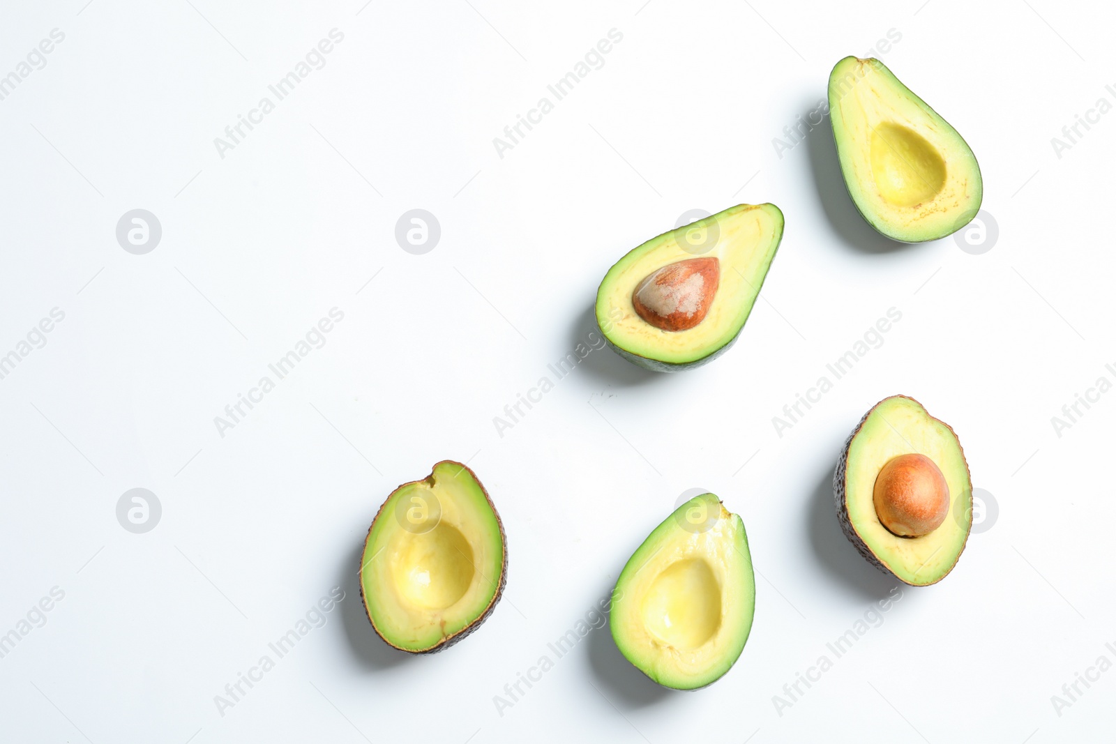 Photo of Composition with ripe fresh avocados on white background