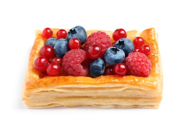 Fresh delicious puff pastry with sweet berries on white background