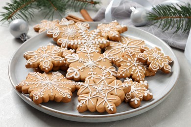 Photo of Tasty Christmas cookies on light grey table, closeup