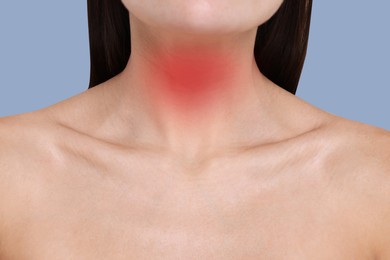 Image of Endocrine system. Woman suffering from pain in thyroid gland on color background, closeup