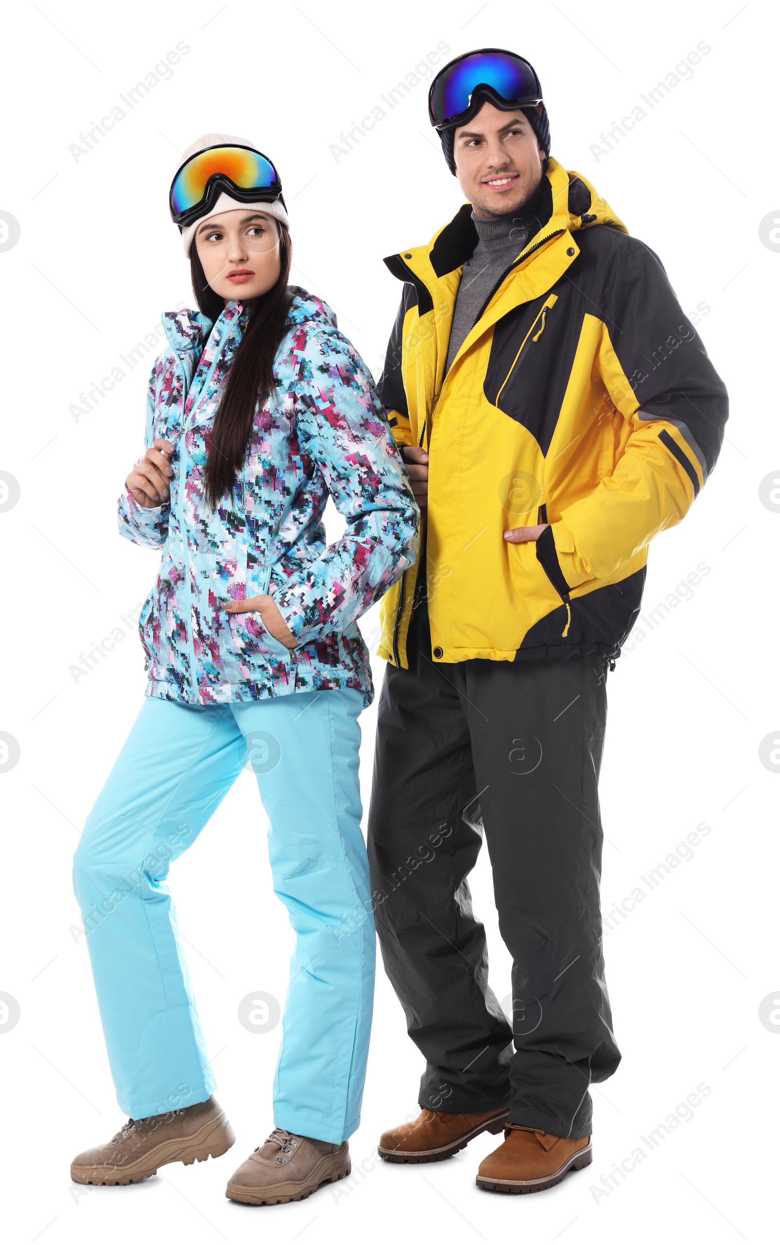 Photo of Couple wearing stylish winter sport clothes on white background