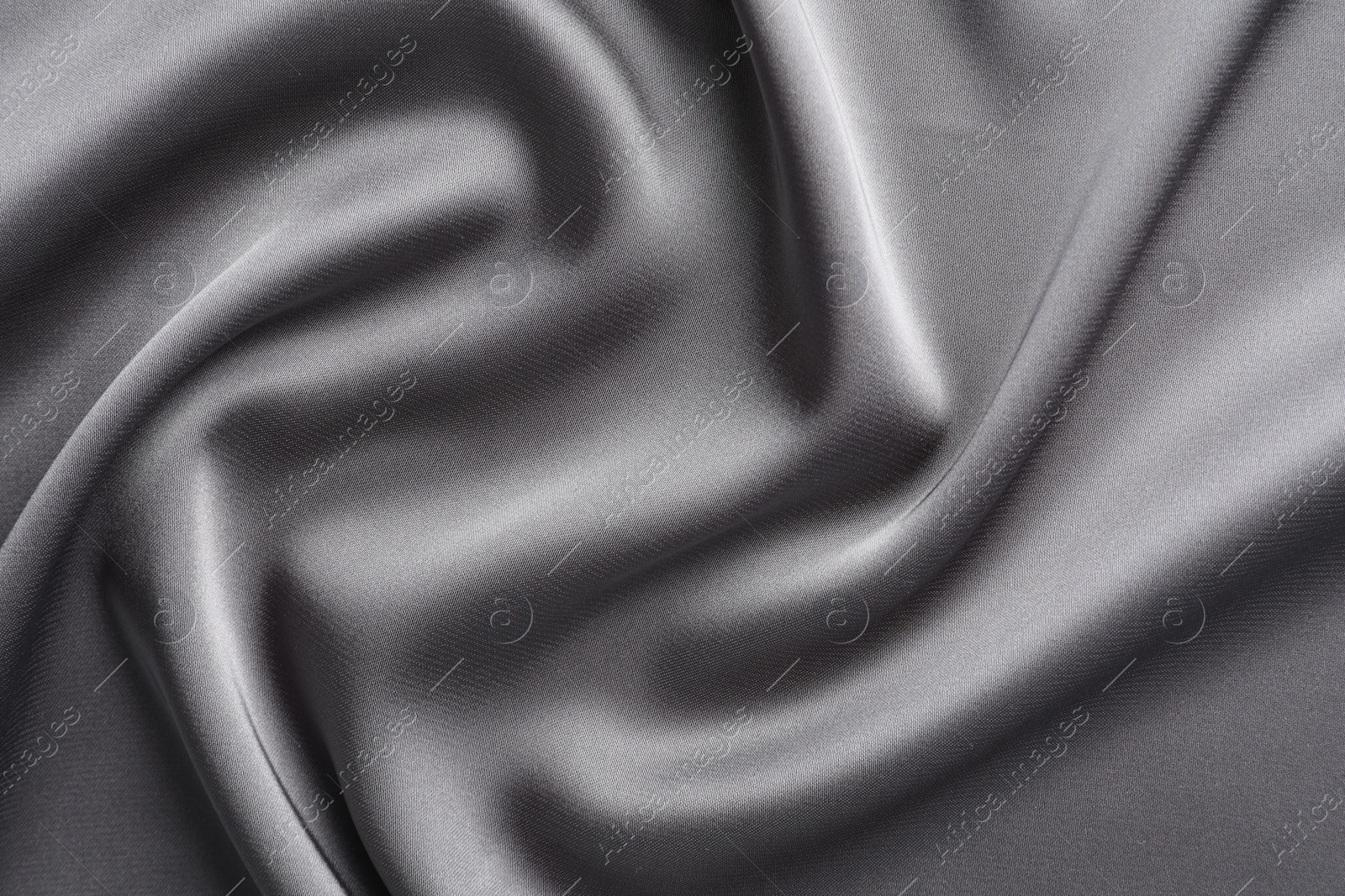 Photo of Texture of beautiful light grey silk fabric as background, closeup