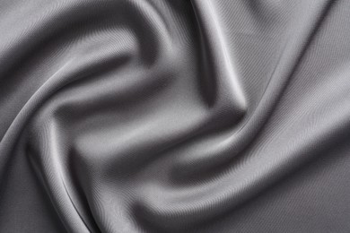 Texture of beautiful light grey silk fabric as background, closeup