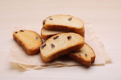 Photo of Sweet hard chuck crackers with raisins on wooden table