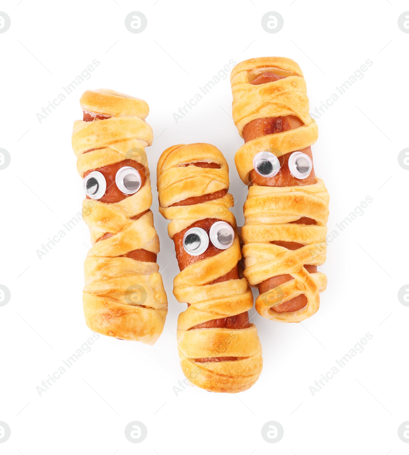 Photo of Tasty sausage mummies for Halloween party isolated on white, top view