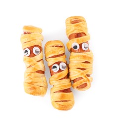 Tasty sausage mummies for Halloween party isolated on white, top view