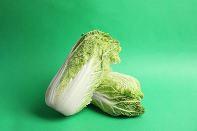 Photo of Fresh ripe cabbages on color background
