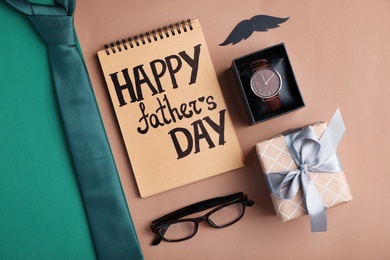 Flat lay composition with male accessories and gift box on color background. Happy Father's Day