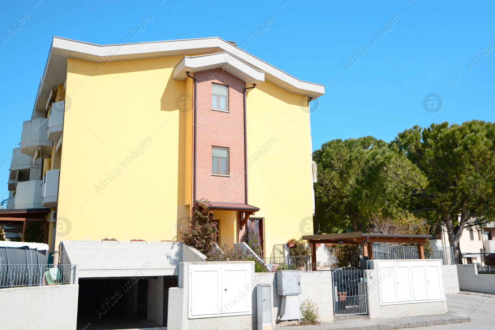 Photo of Picturesque view of beautiful building and trees on city street