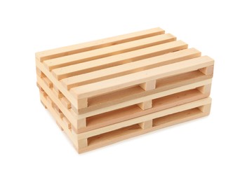 Stack of small wooden pallets on white background