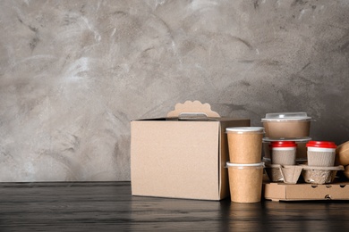 Various takeout containers on table, space for text. Food delivery service