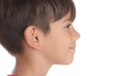 Cute little boy on white background, closeup. Hearing problem