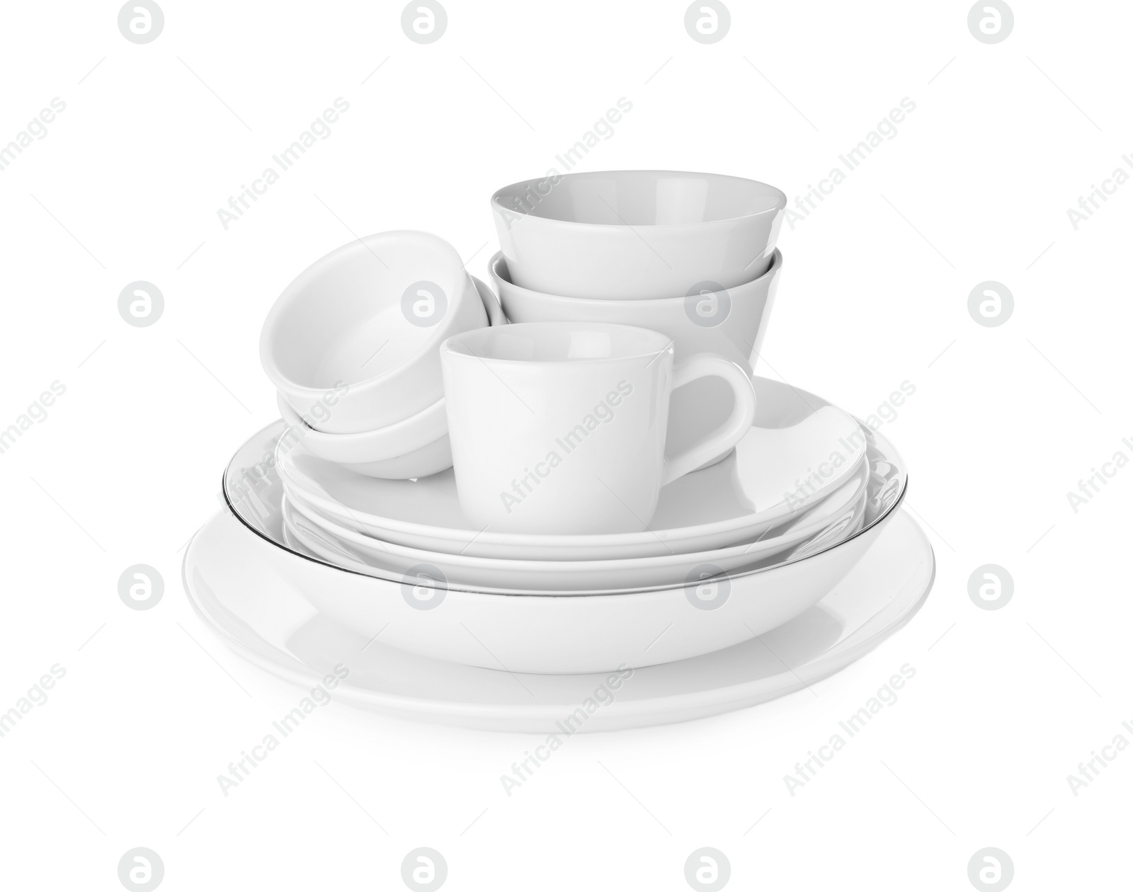 Photo of Stack of clean dishware isolated on white