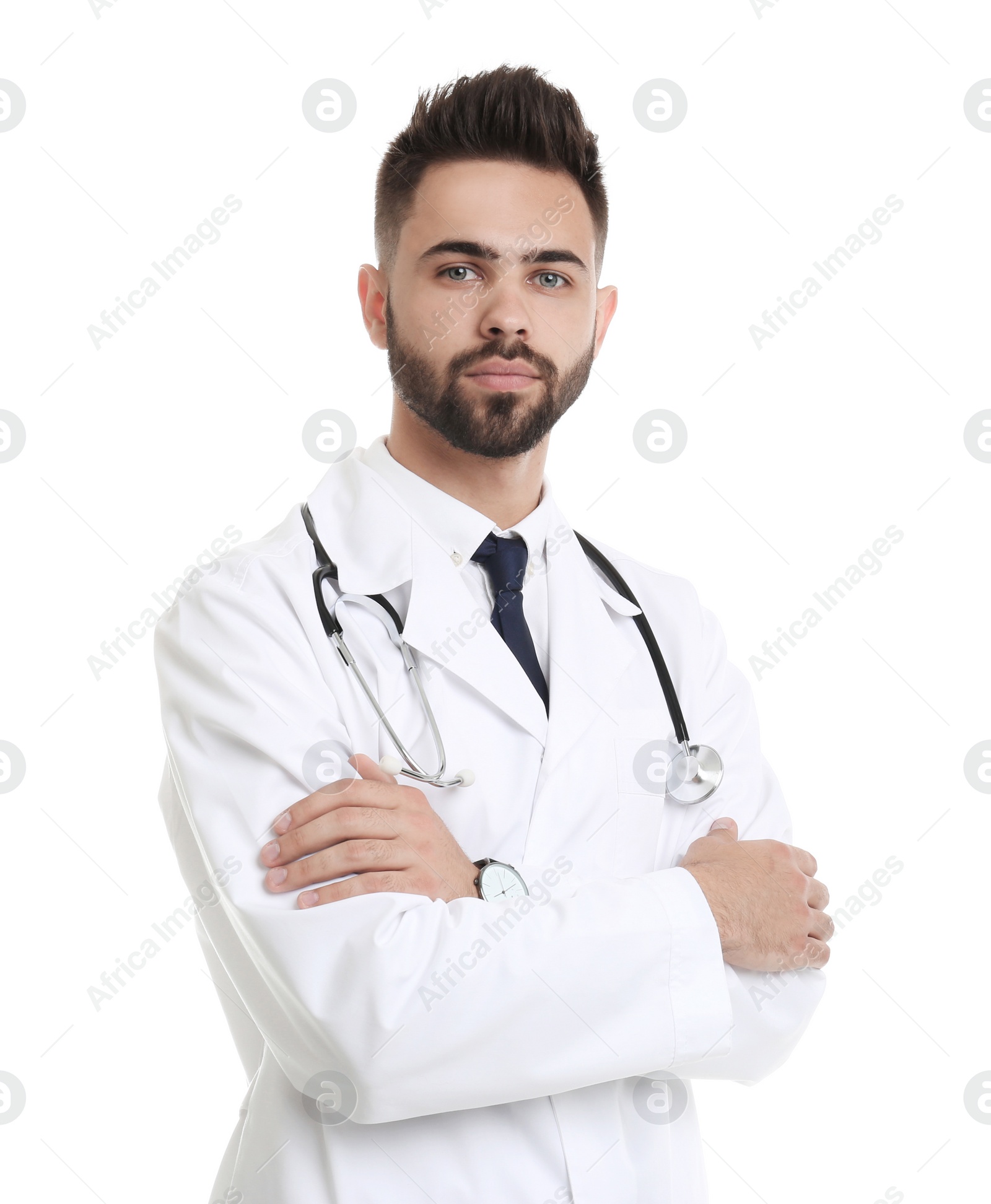 Photo of Young male doctor in uniform isolated on white