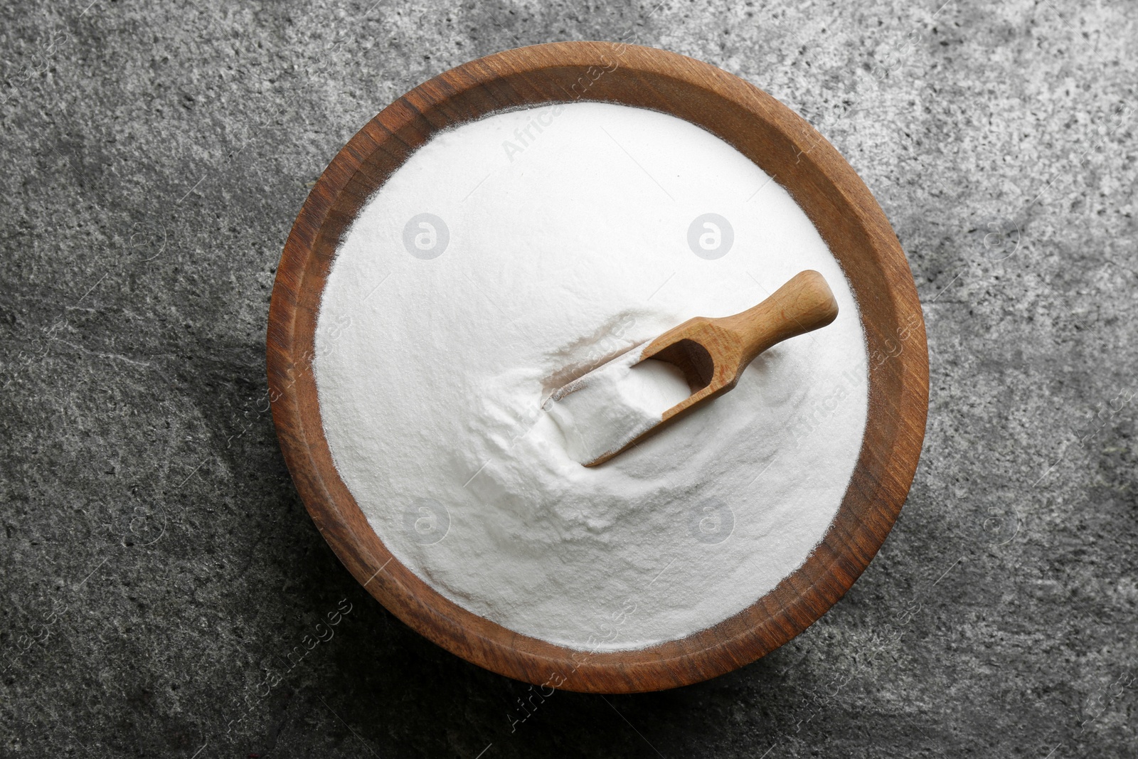 Photo of Baking soda on grey table, top view