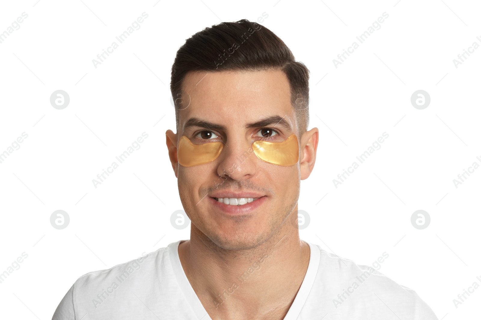 Photo of Man with golden under eye patches on white background