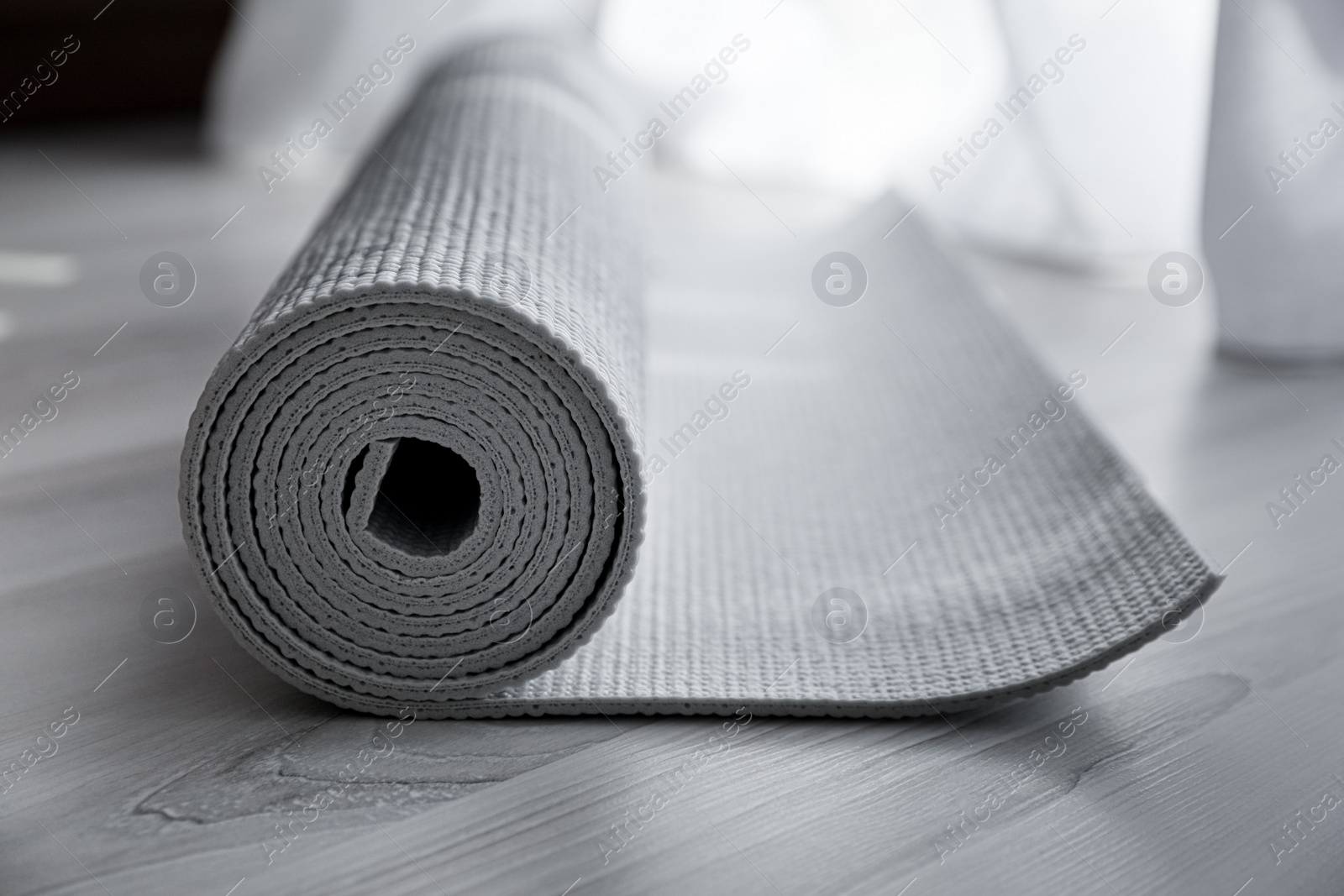 Photo of Karemat or fitness mat on floor, closeup